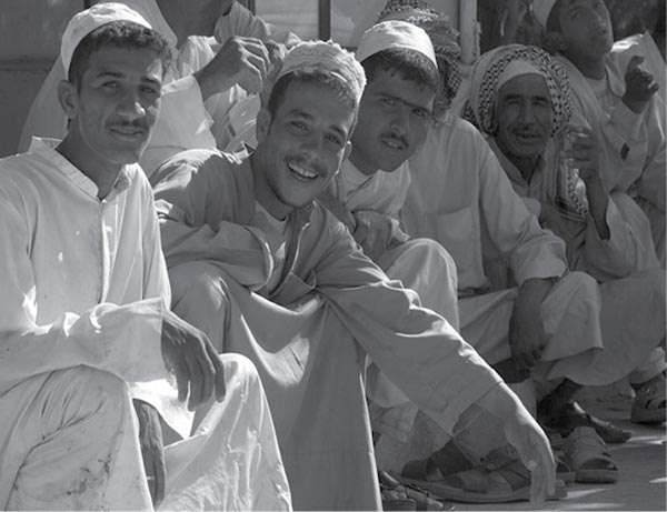 Residents of Najaf celebrate the ending of the Madhi Militia uprising in Najaf, August 2004.